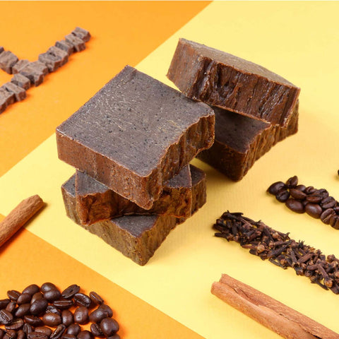Temazcal Life bar soap Cafe without label and ingredients coffee, cocoa butter, cinnamon, and clove on yellow background.